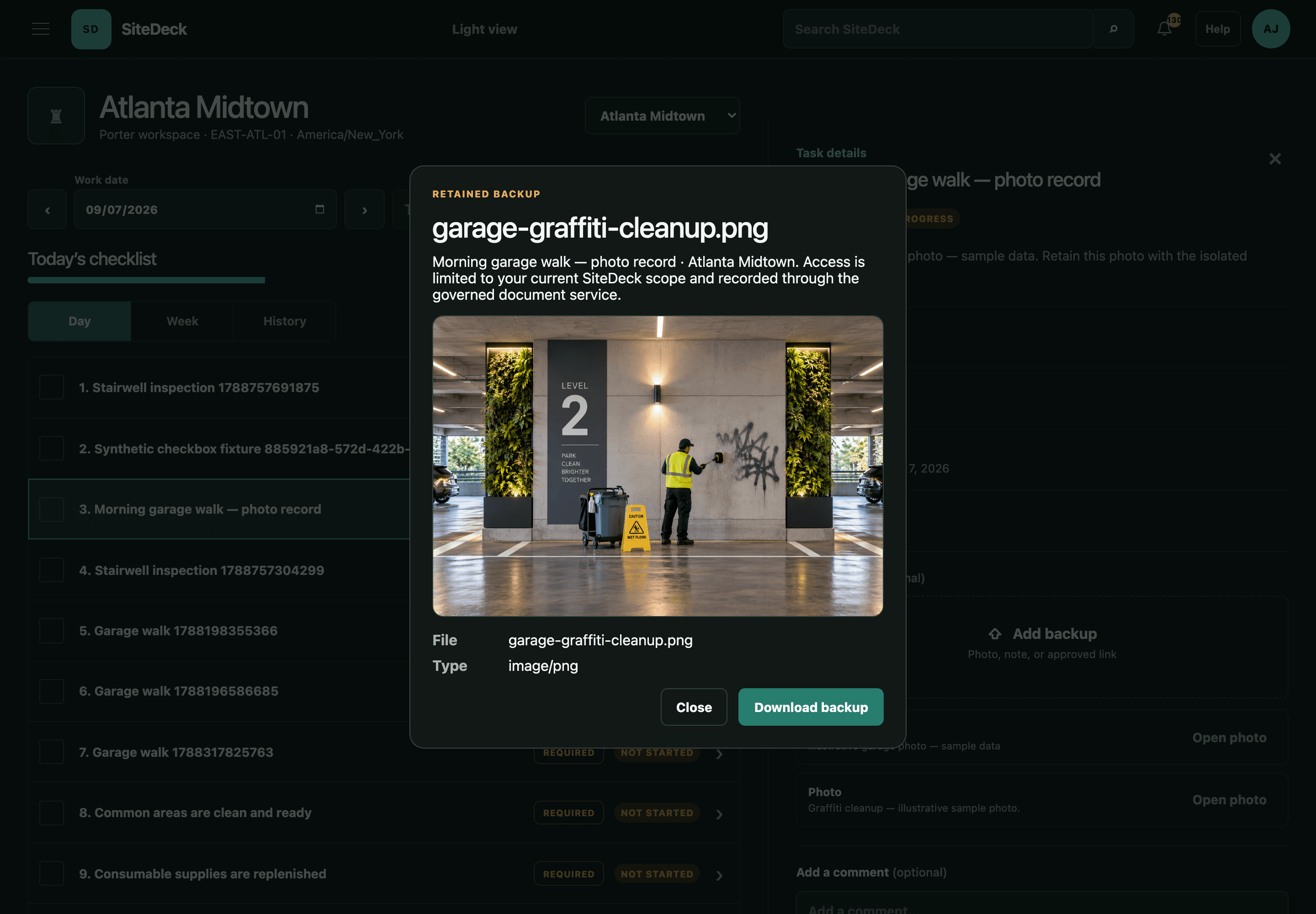 SiteDeck Porter task showing an attached image of a worker cleaning graffiti in a sample task record.
